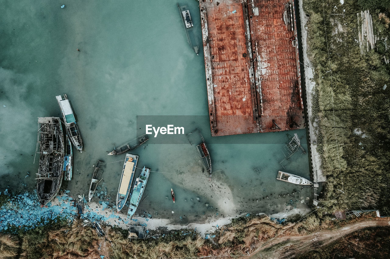 Drone view of damaged boat on lake