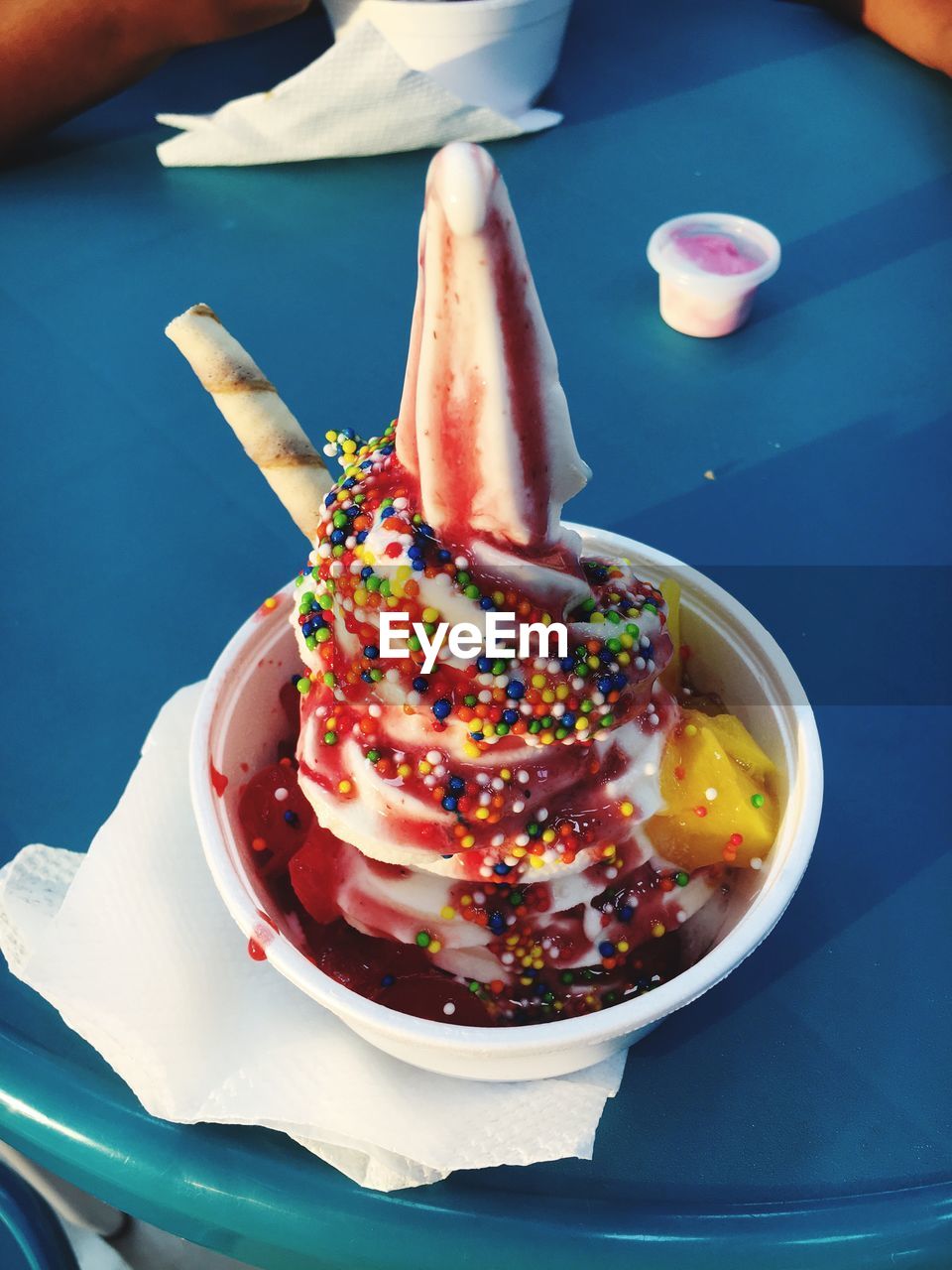 HIGH ANGLE VIEW OF ICE CREAM IN PLATE ON TABLE