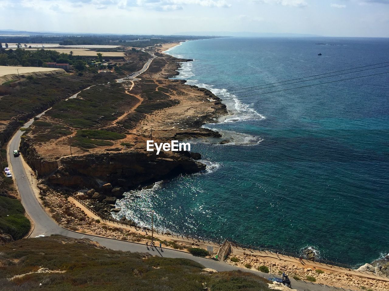 Scenic view of coastline against sky