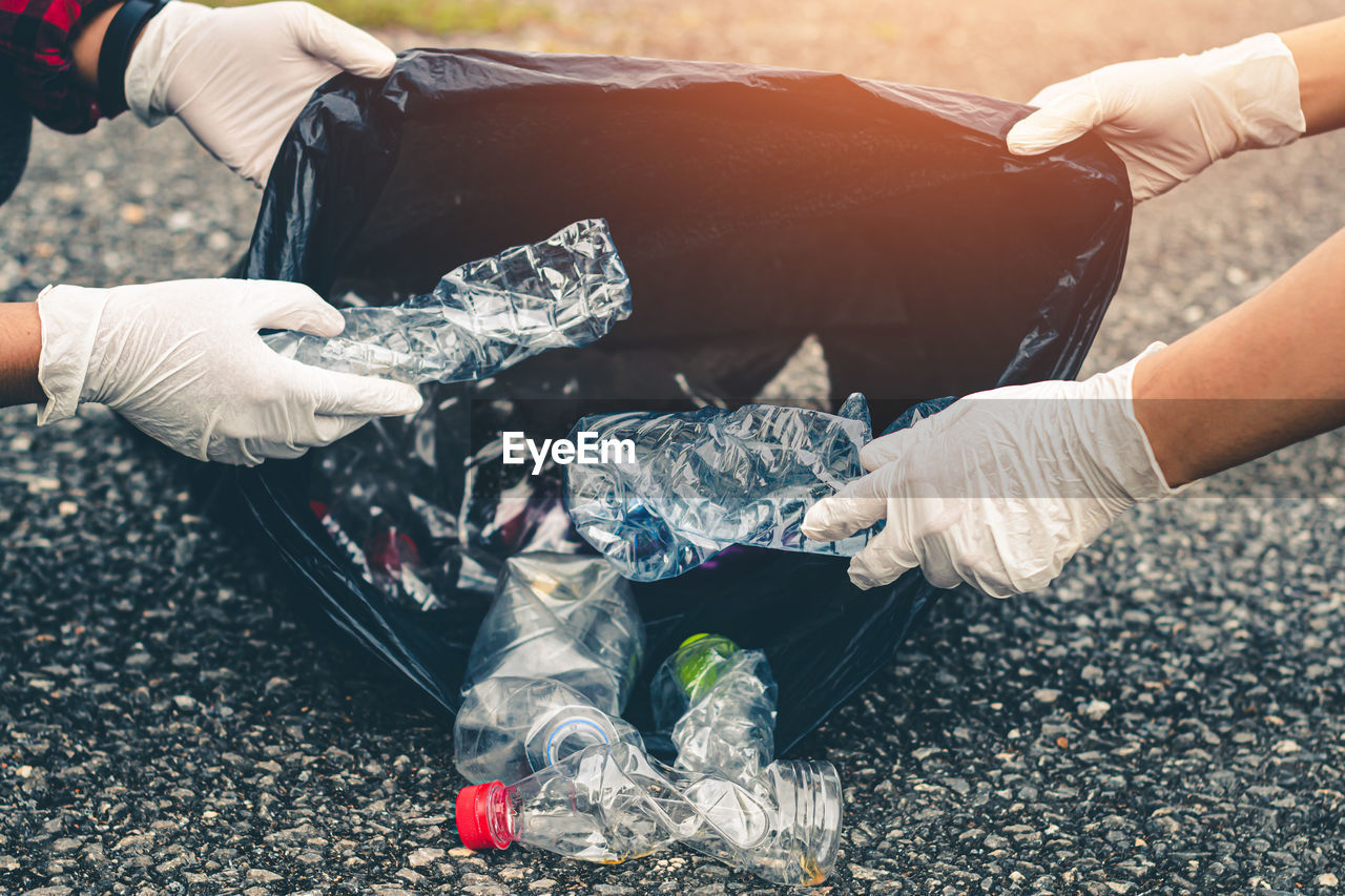 Women volunteer help garbage collection for to recycling environment.