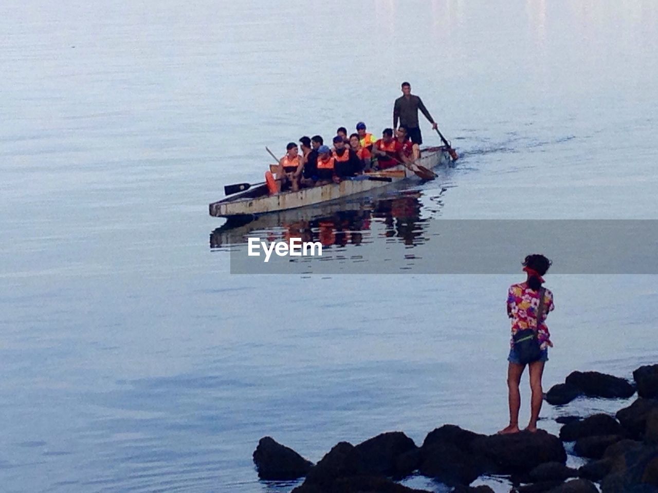 PEOPLE ENJOYING IN BOAT ON LAKE