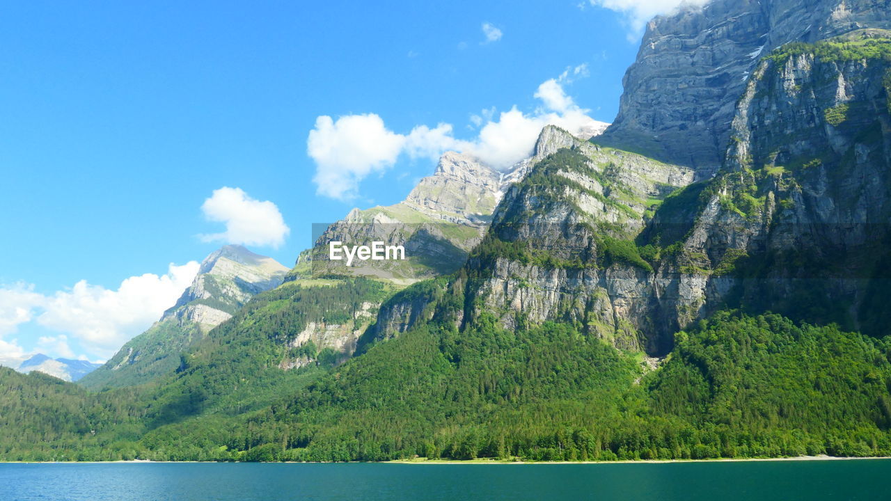 PANORAMIC VIEW OF LAKE AND MOUNTAIN AGAINST SKY