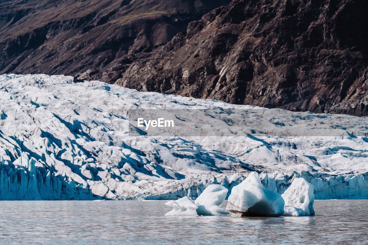 scenic view of snowcapped mountains during winter