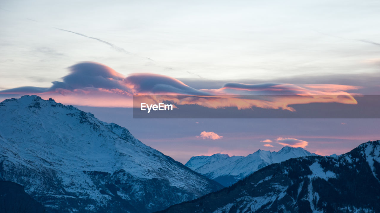 Idyllic shot of snowcapped mountains against sky