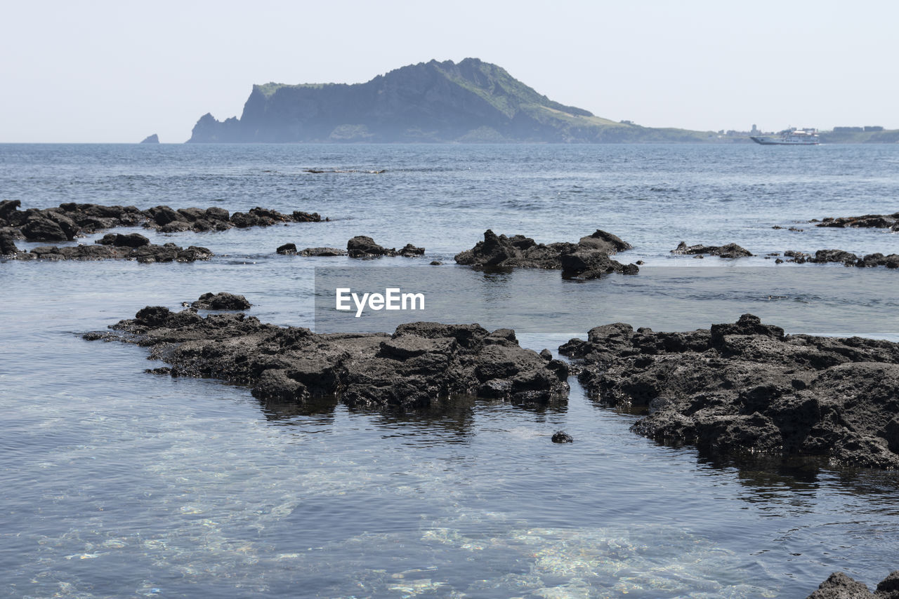 Scenic view of sea against clear sky