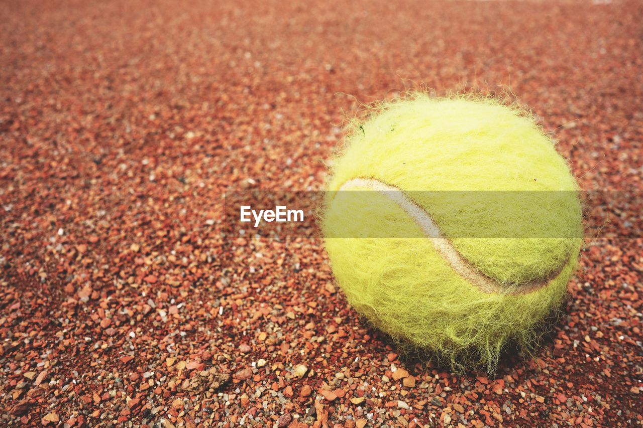 Close-up of yellow ball on field