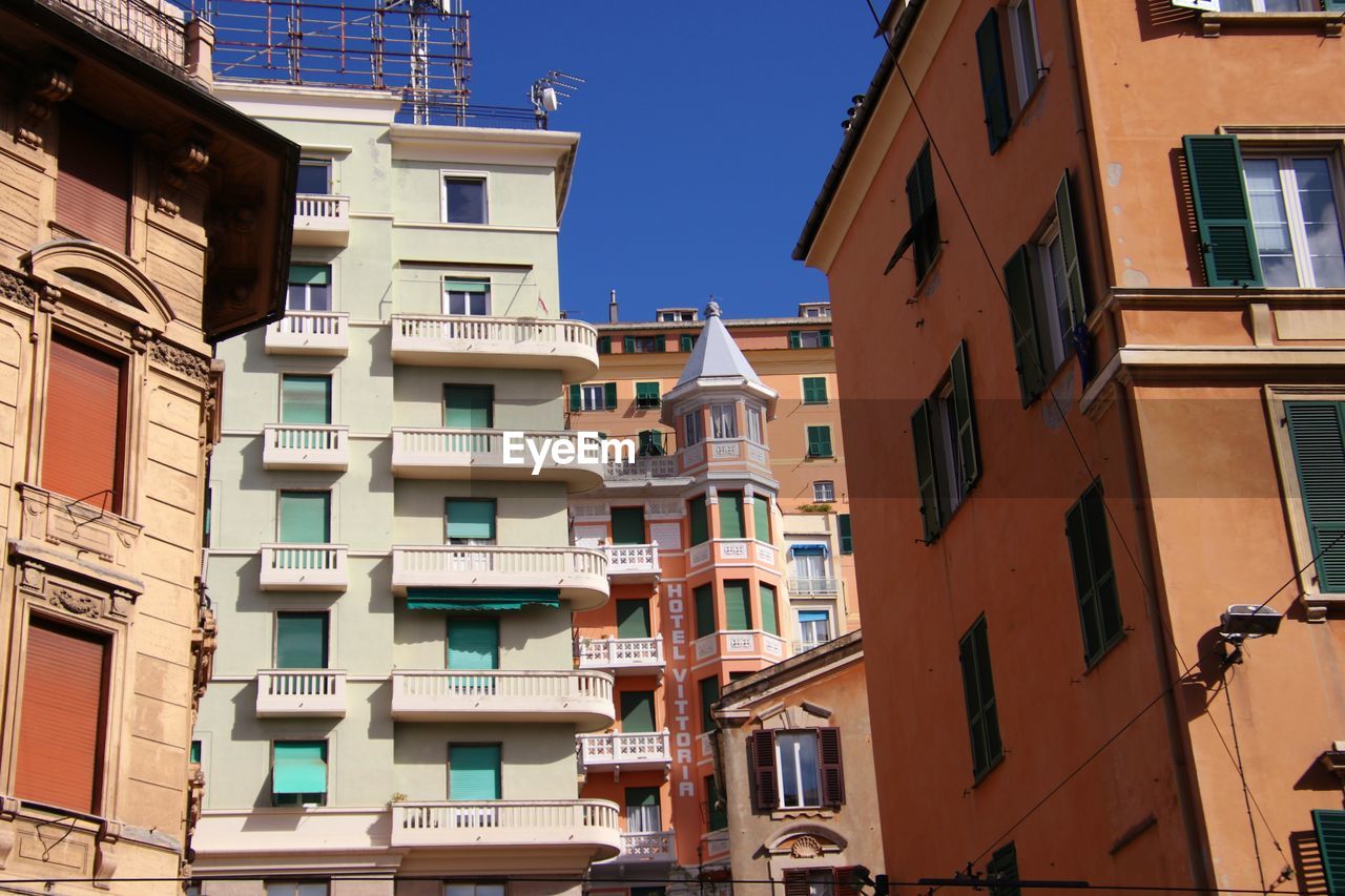 Low angle view of buildings against clear sky