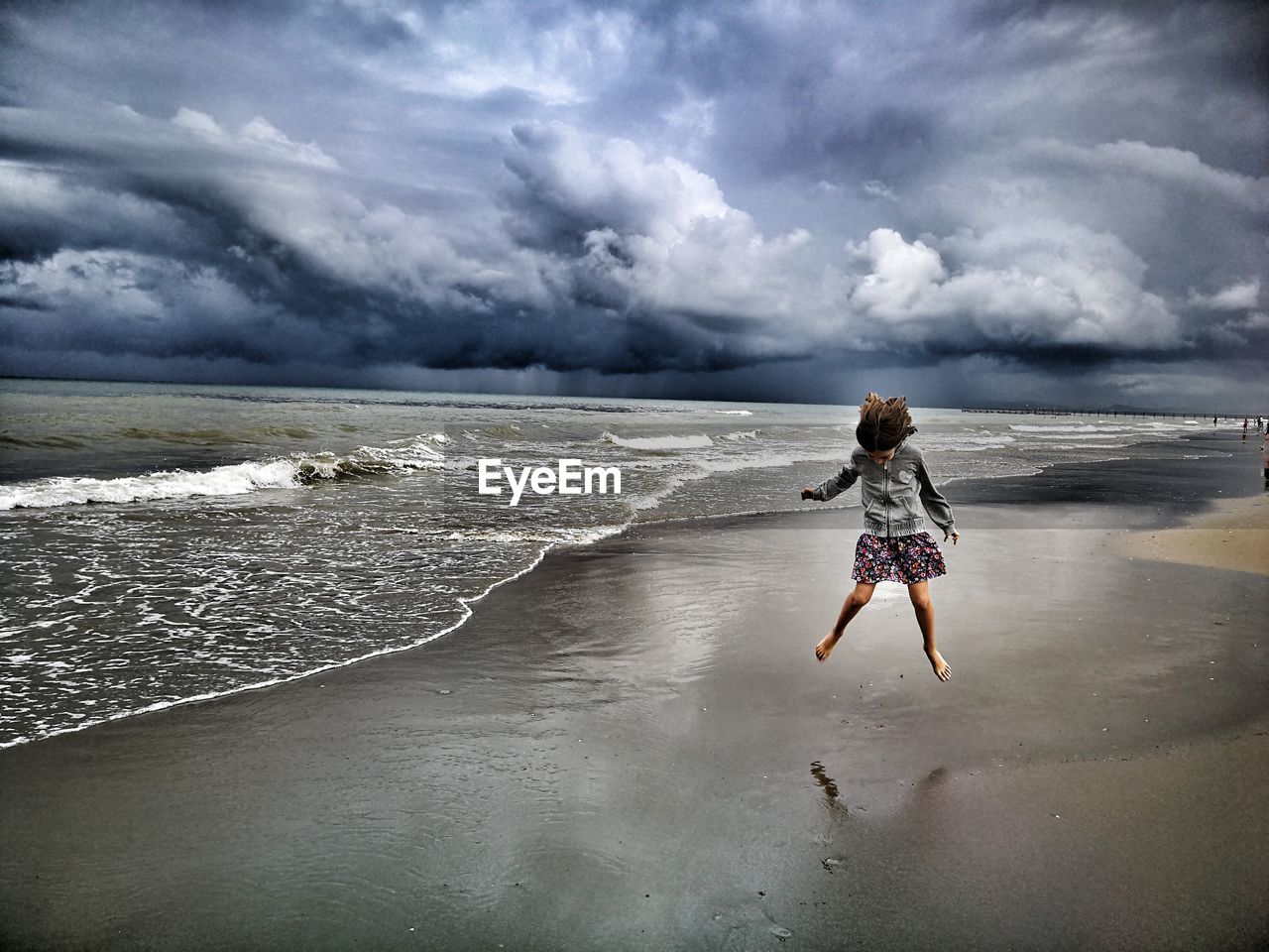 Girl jumping at beach