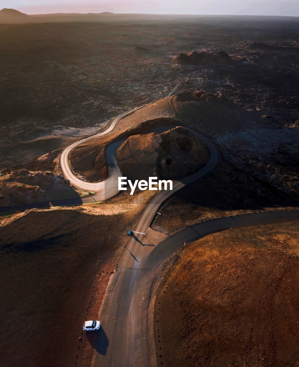 Aerial view of winding road amidst landscape