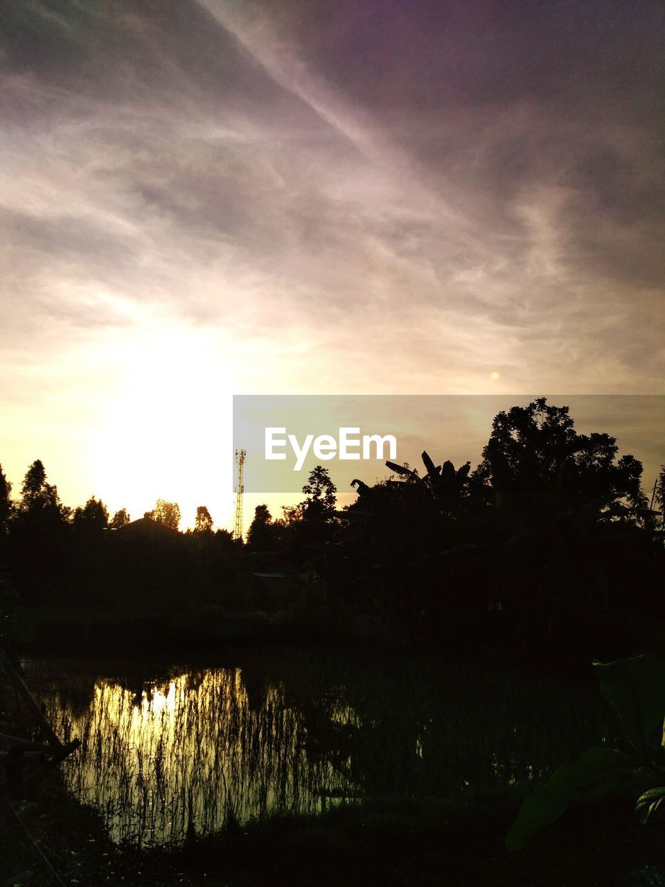 SCENIC VIEW OF SILHOUETTE LANDSCAPE AGAINST SKY AT SUNSET