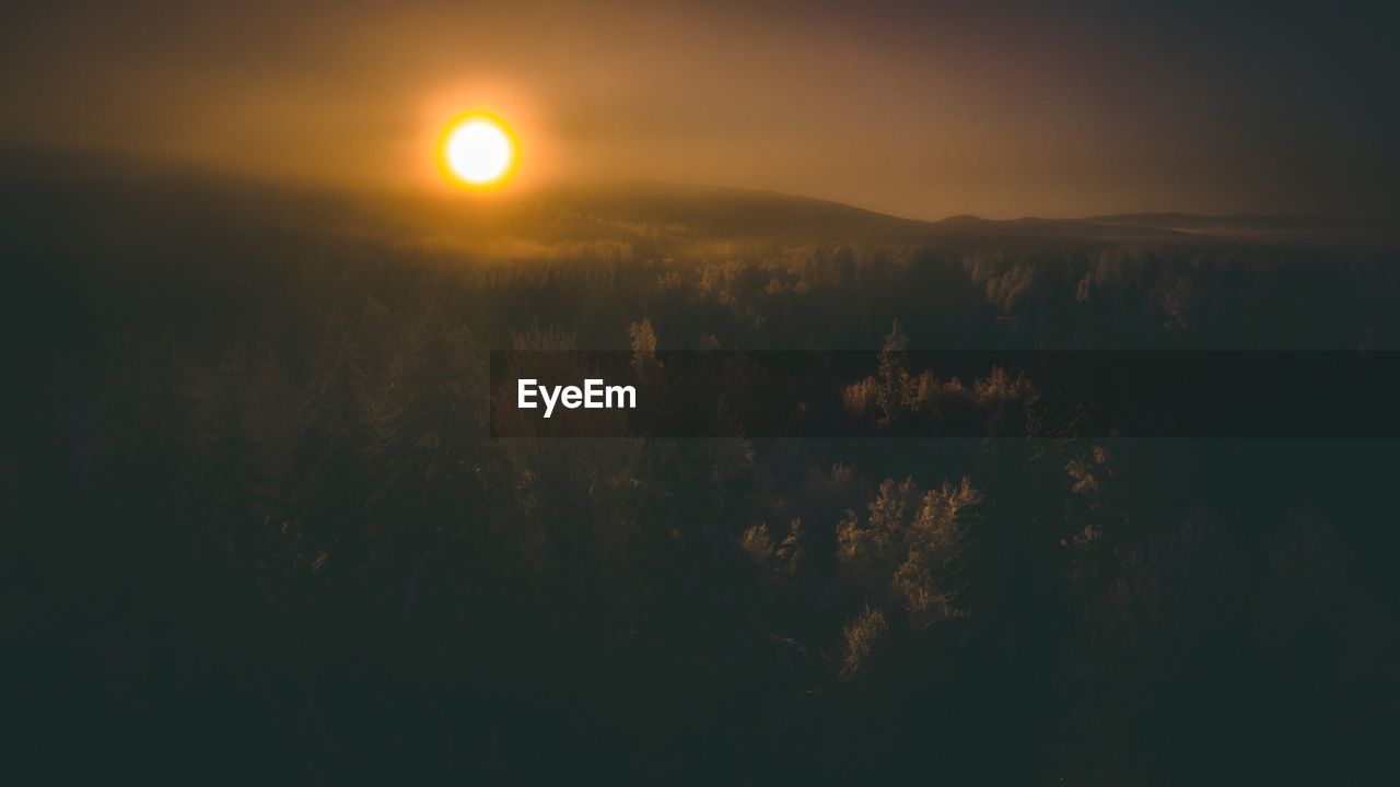 Scenic view of landscape against sky during sunset