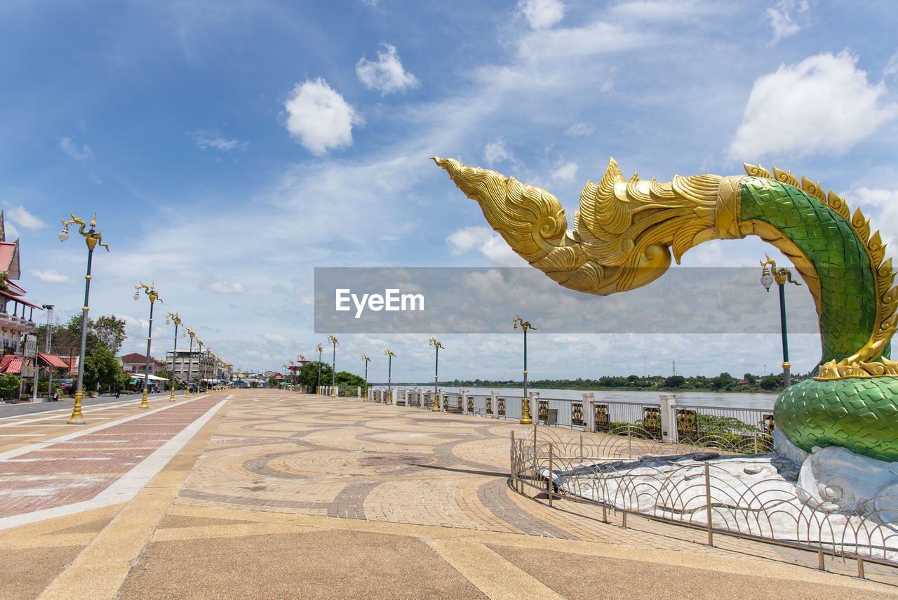 STATUE AGAINST SKY IN CITY