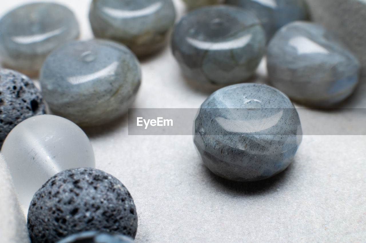 bead, close-up, pebble, iron, button, art, no people, fashion accessory, indoors