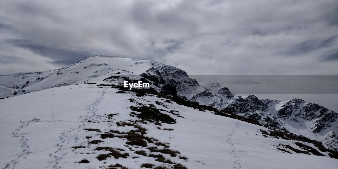 Snow covered mountain against sky