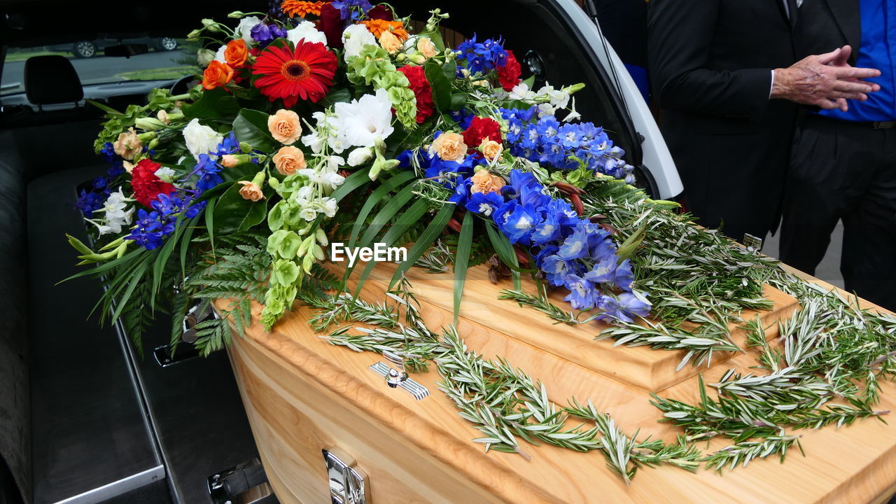 Close-up of decorated coffin during funeral