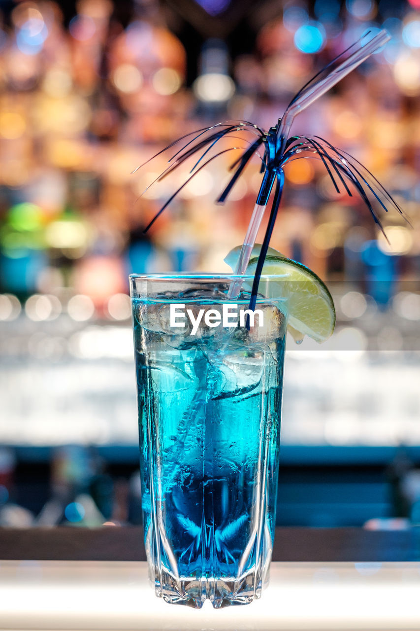 Close-up of azure lemonade cocktail on bar counter