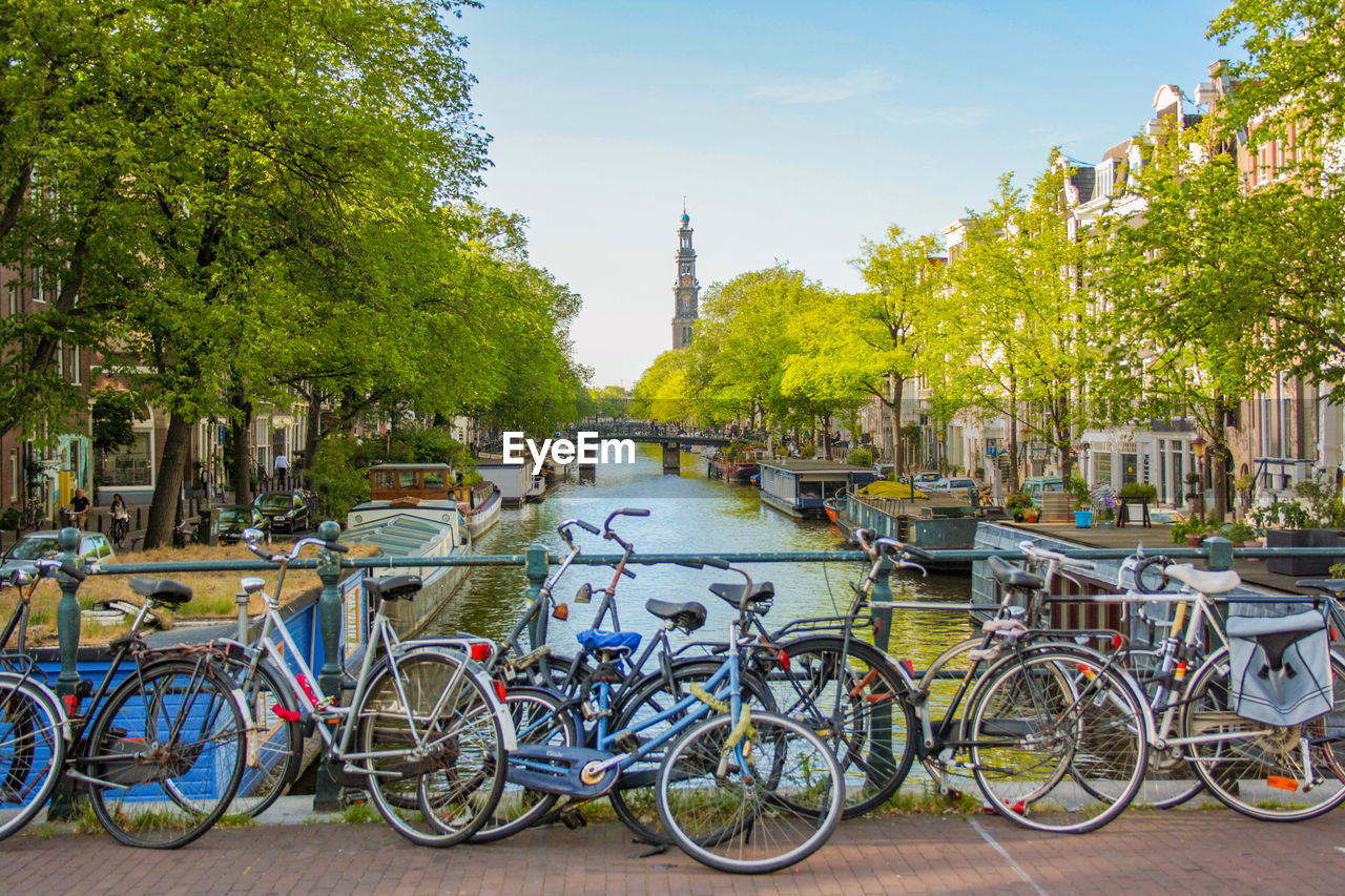 BICYCLES PARKED BY RIVER