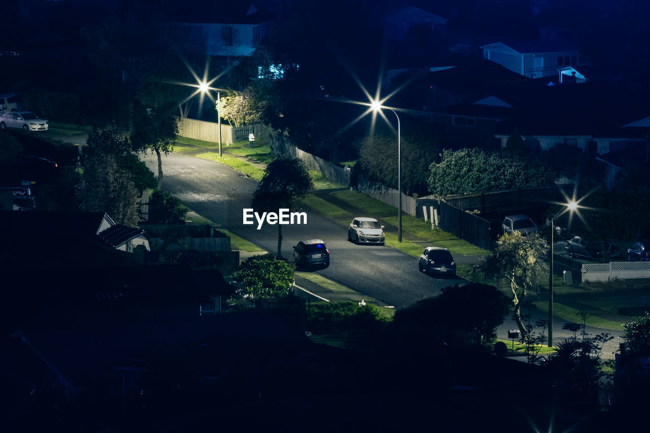 CARS ON STREET AT NIGHT