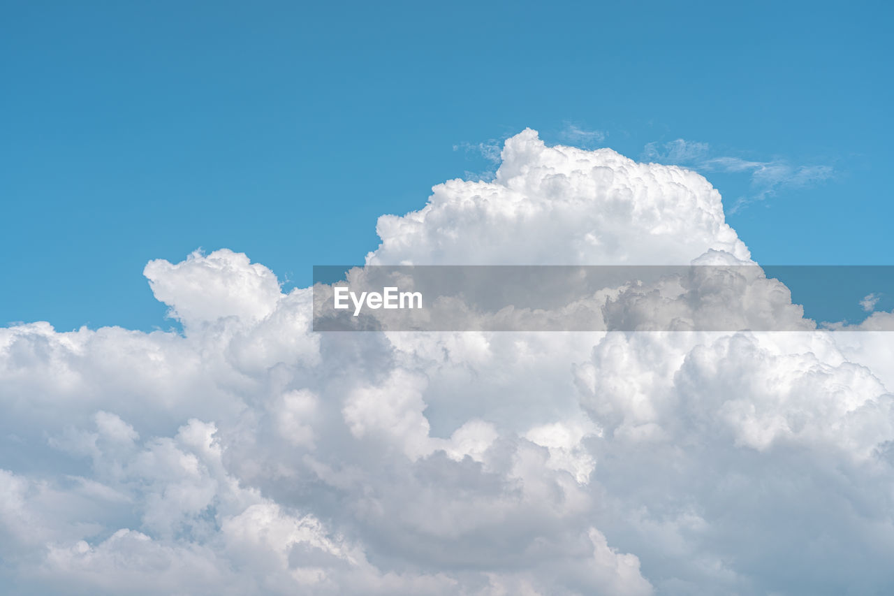 LOW ANGLE VIEW OF WHITE CLOUDS IN BLUE SKY