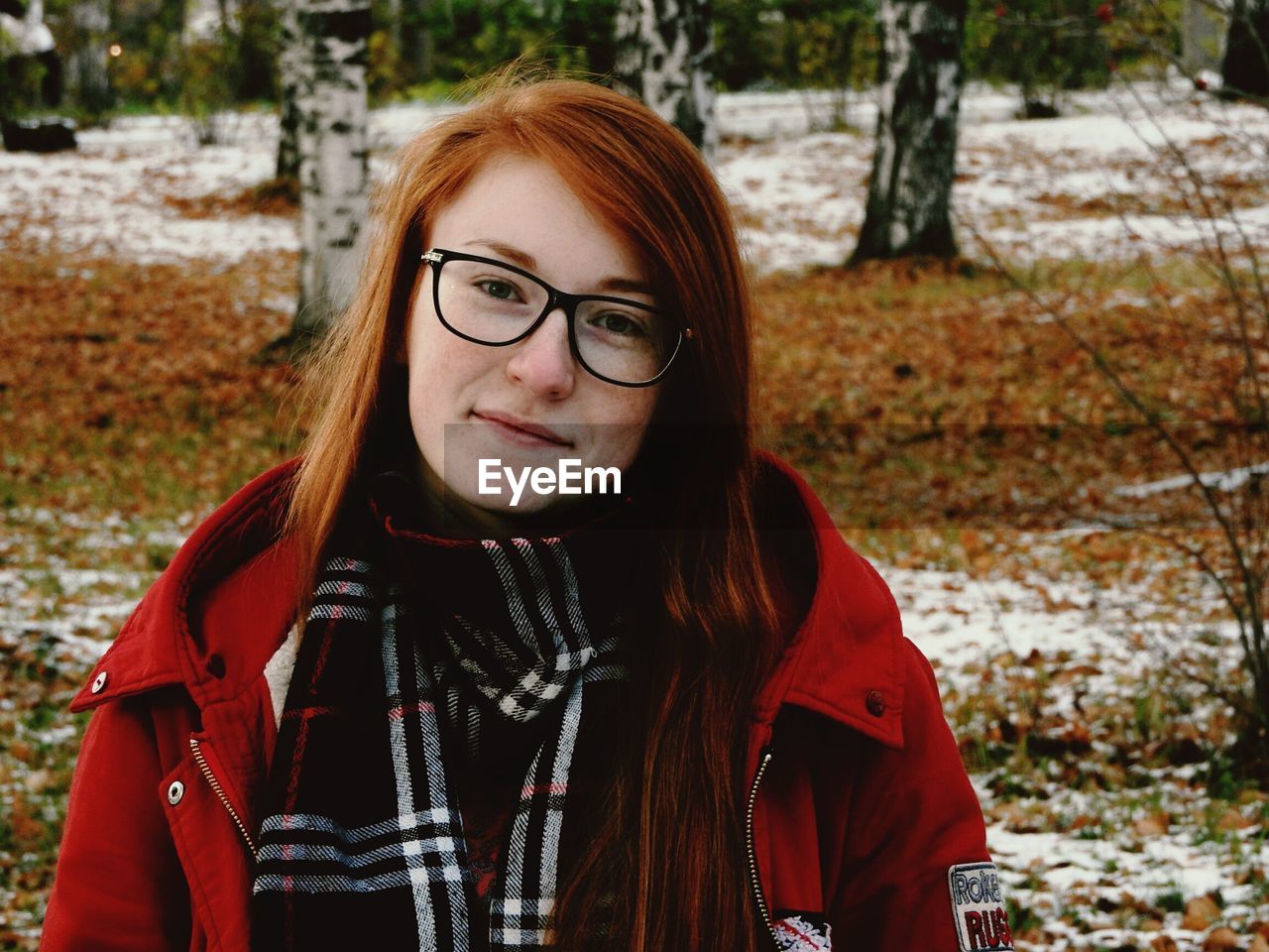 Portrait of young woman wearing eyeglasses during winter