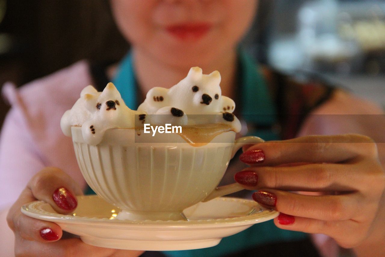 Close-up of woman holding ice cream