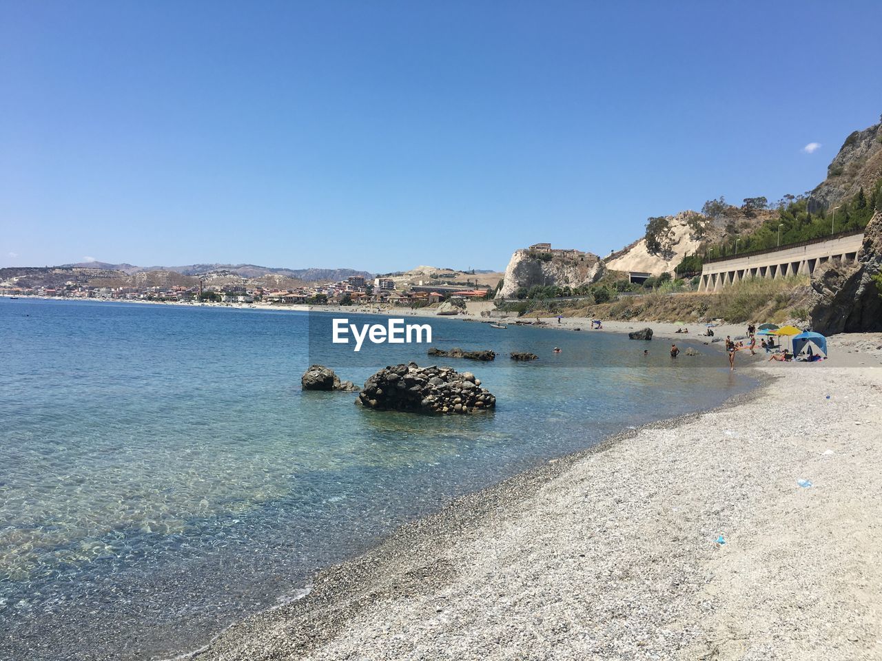 Scenic view of sea against clear blue sky