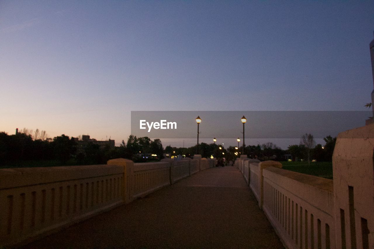 STREET AGAINST SKY AT DUSK