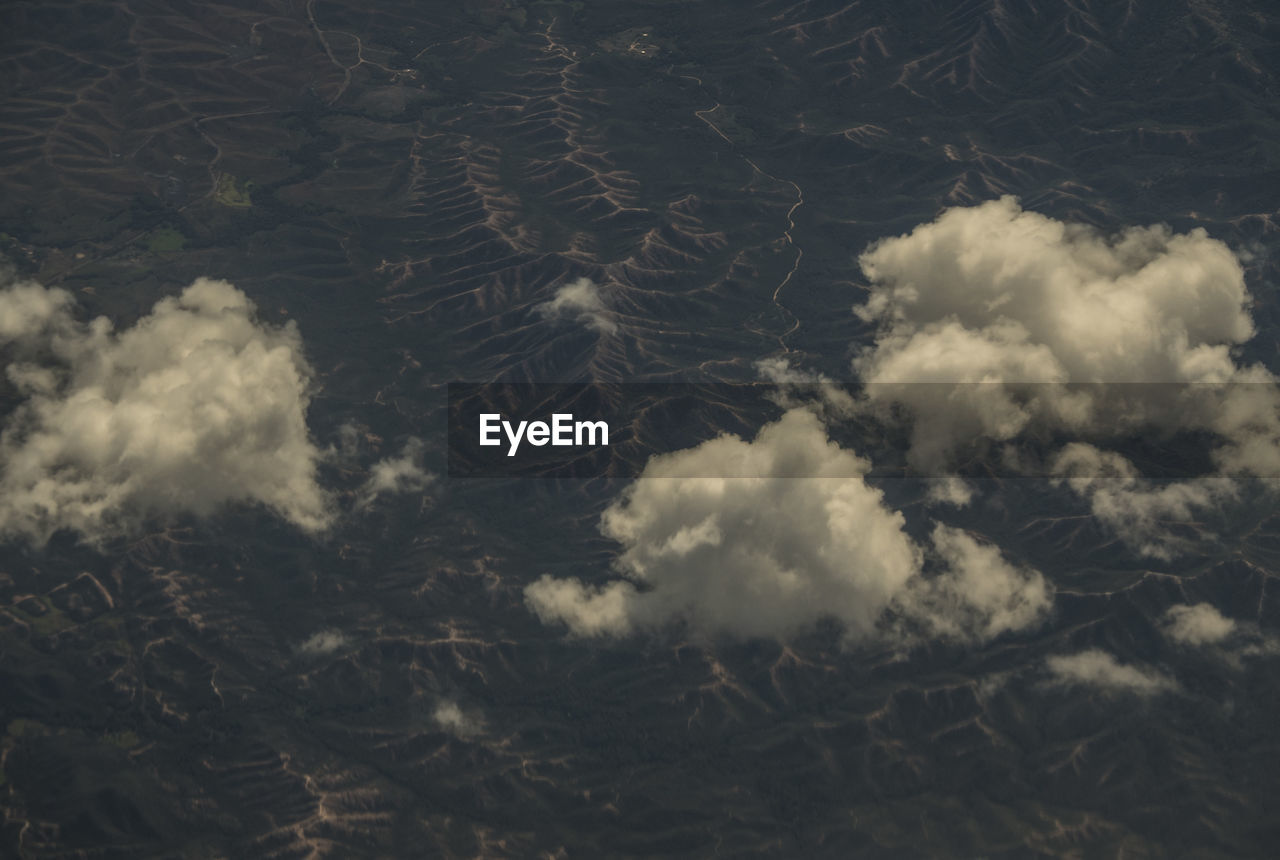 Low angle view of clouds in field against sky