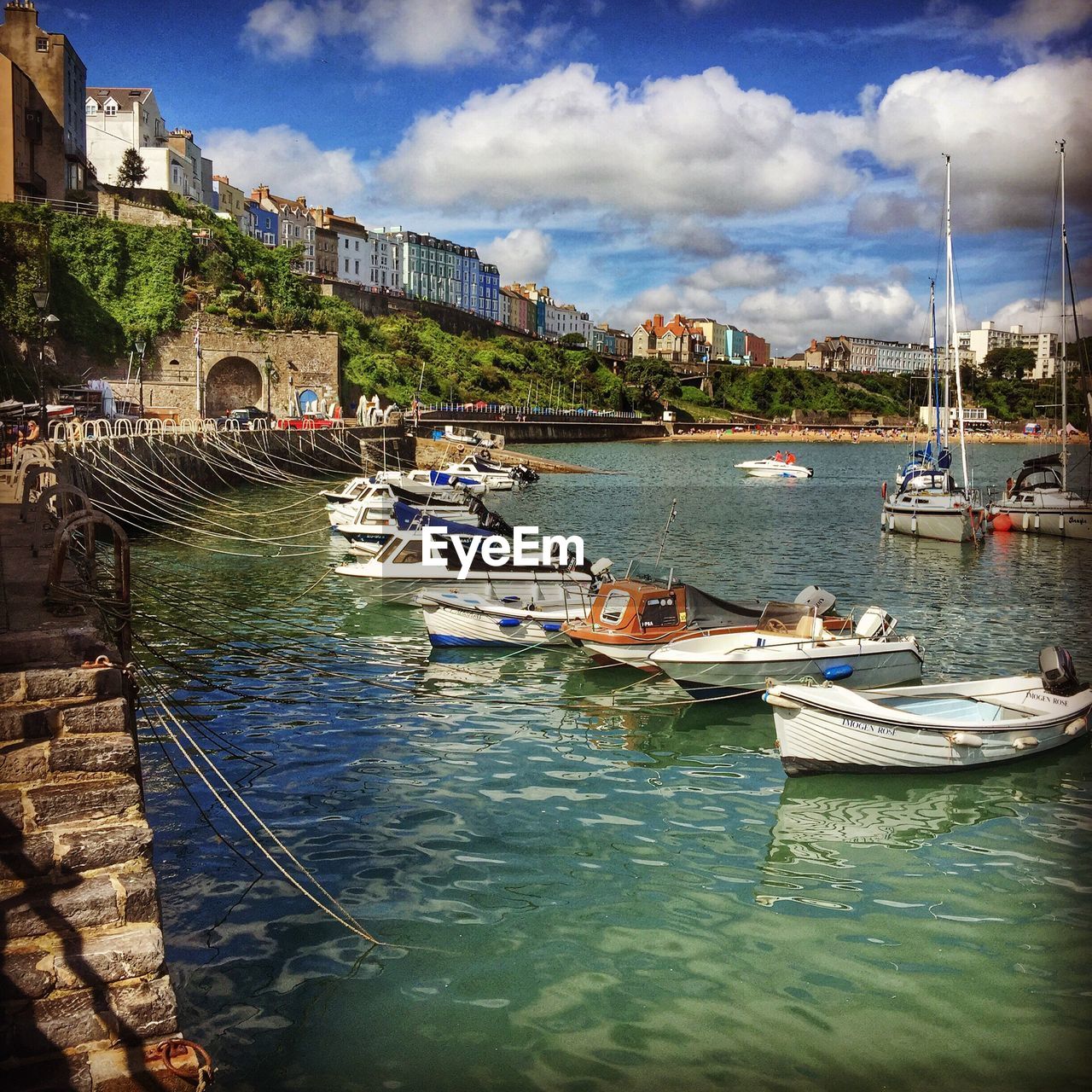 Boats moored at harbor