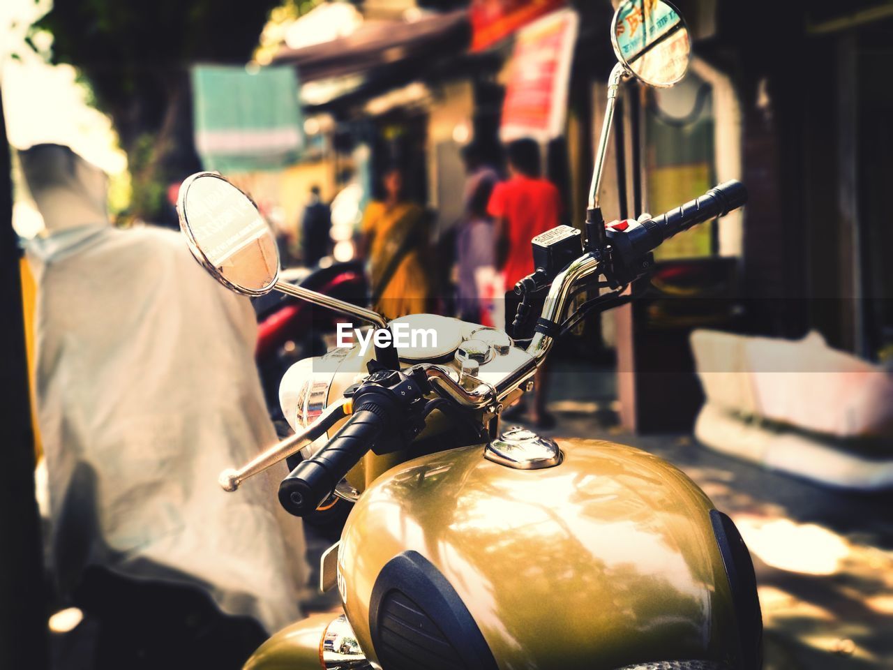 Close-up of motor scooter on street