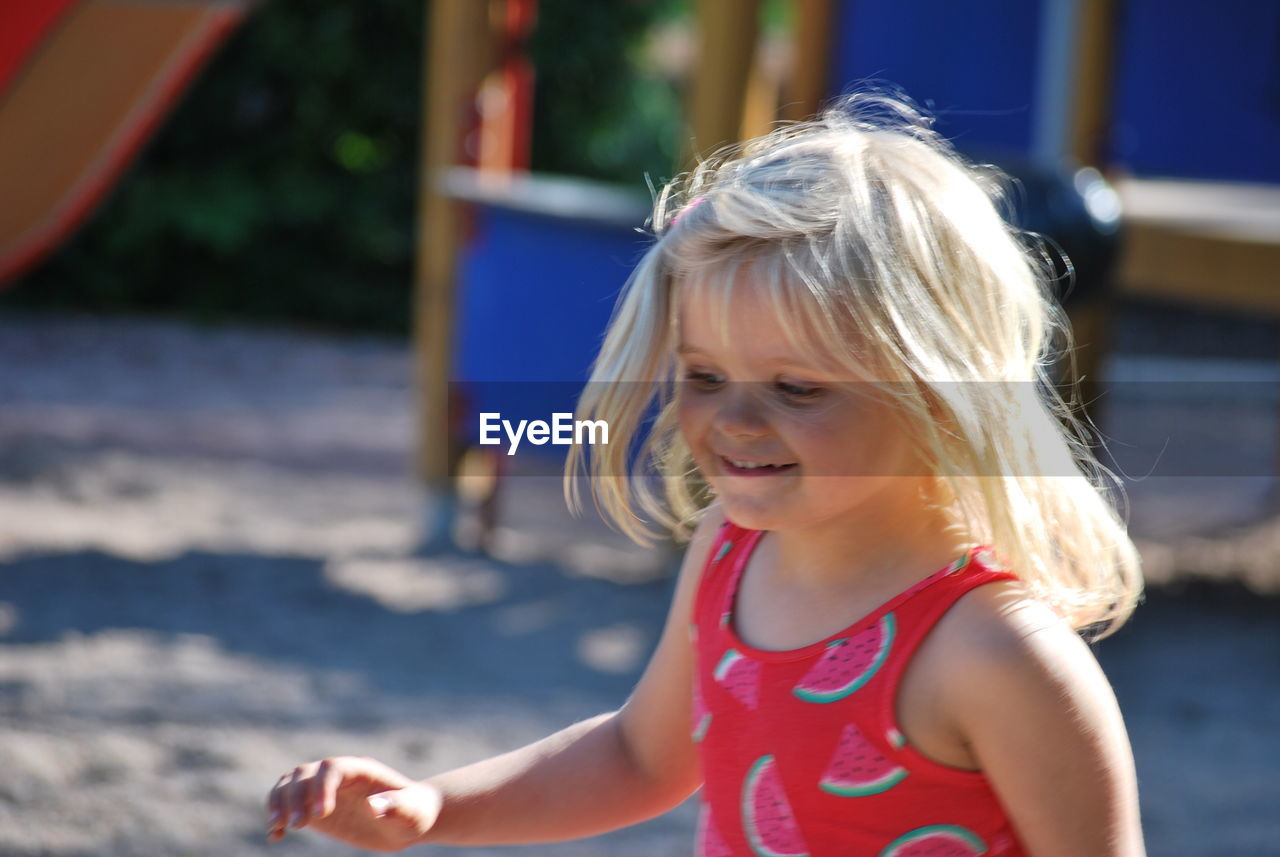 Cute girl playing at playground in park