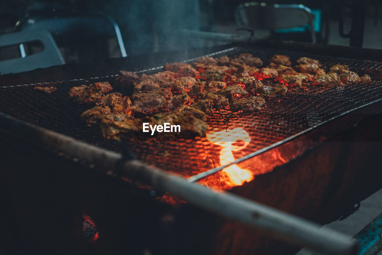 Close-up of meat on barbecue grill