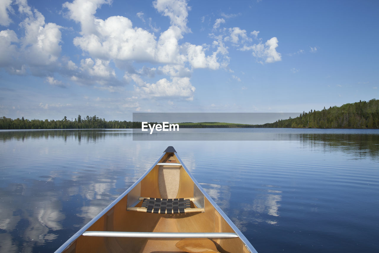 scenic view of lake against cloudy sky