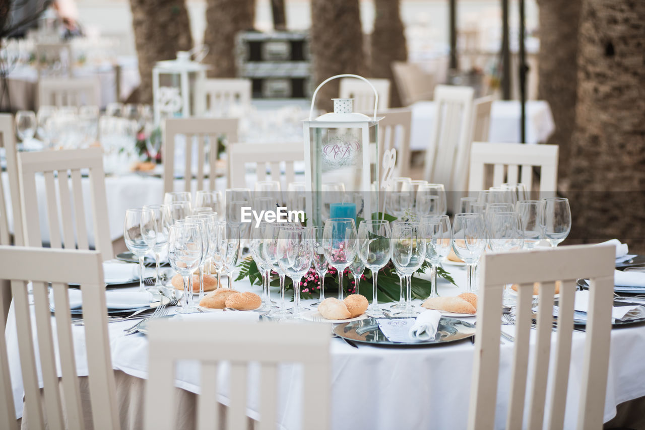 EMPTY CHAIRS AND TABLES ON TABLE