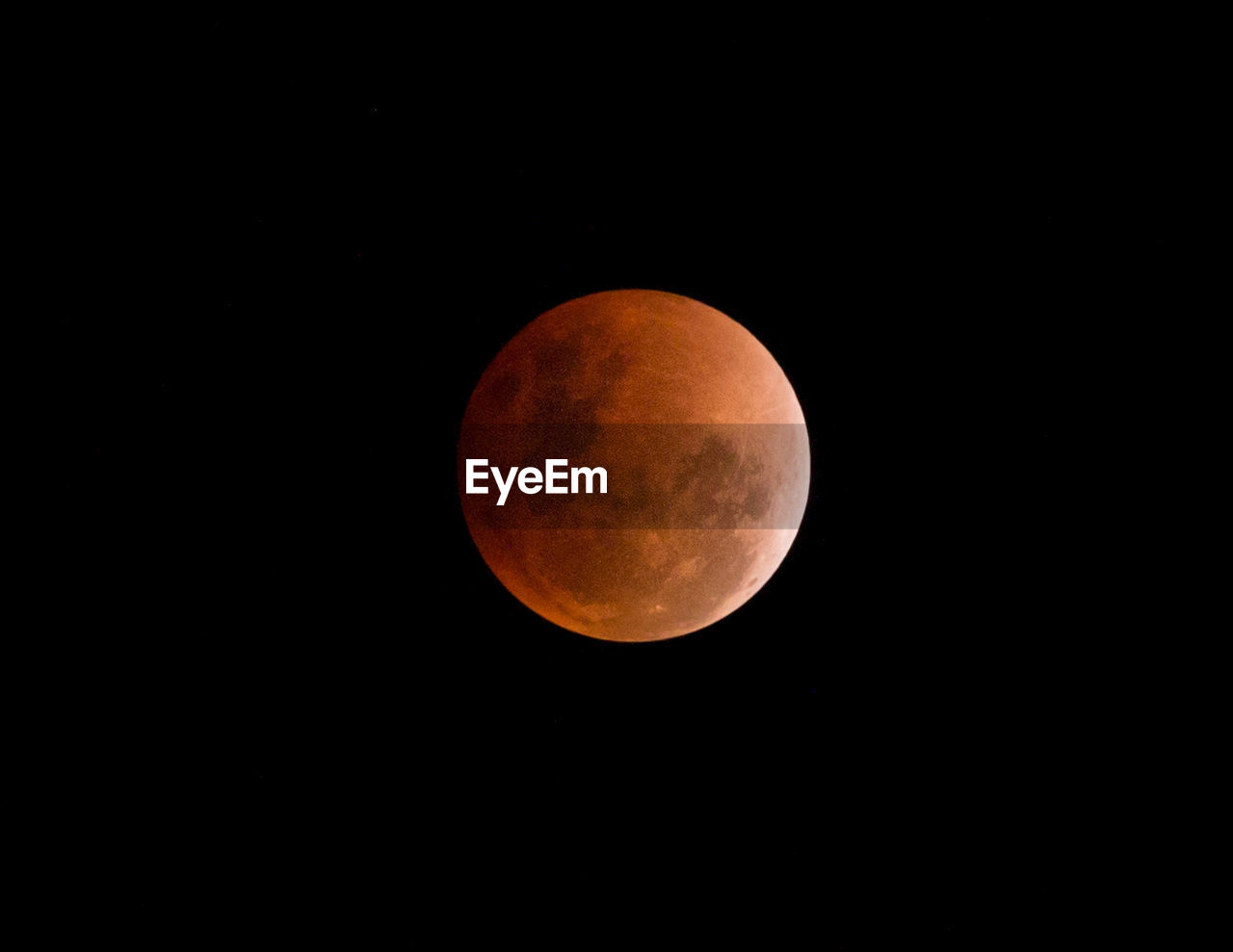 LOW ANGLE VIEW OF MOON AGAINST CLEAR SKY