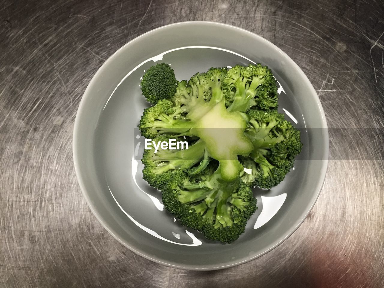 High angle view of broccoli in bowl on sink