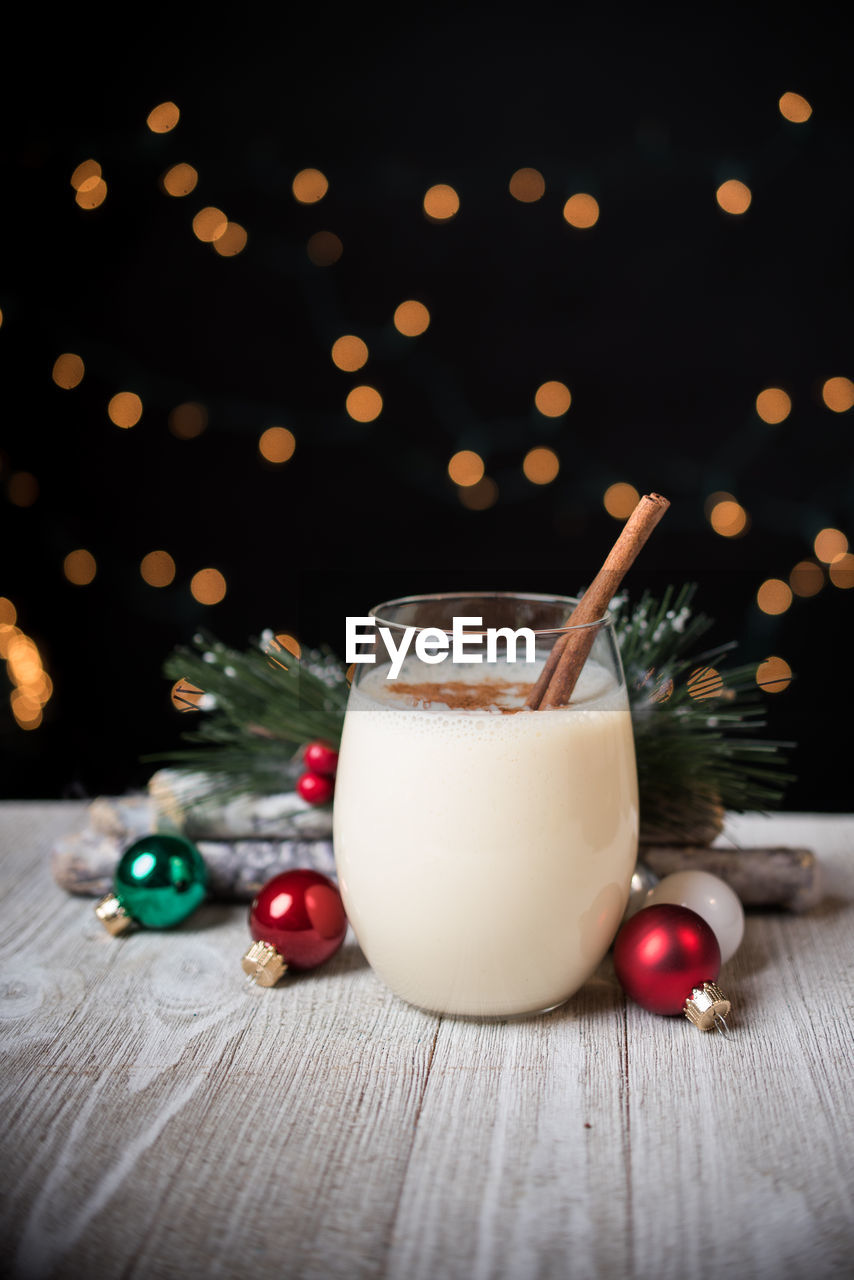 Close-up of eggnog in glass on table