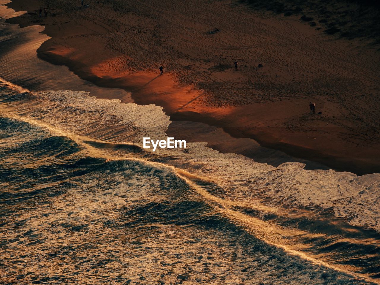 Elevated view of beach at sunset