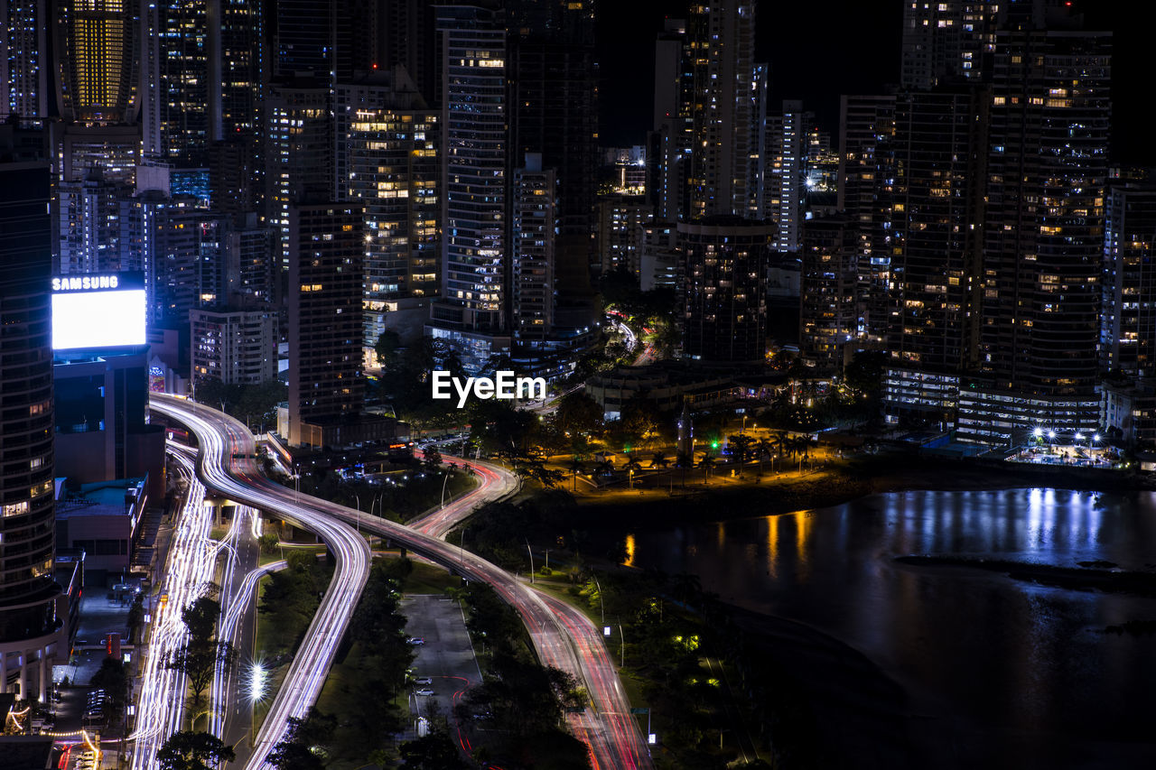 High angle view of illuminated buildings in city at night