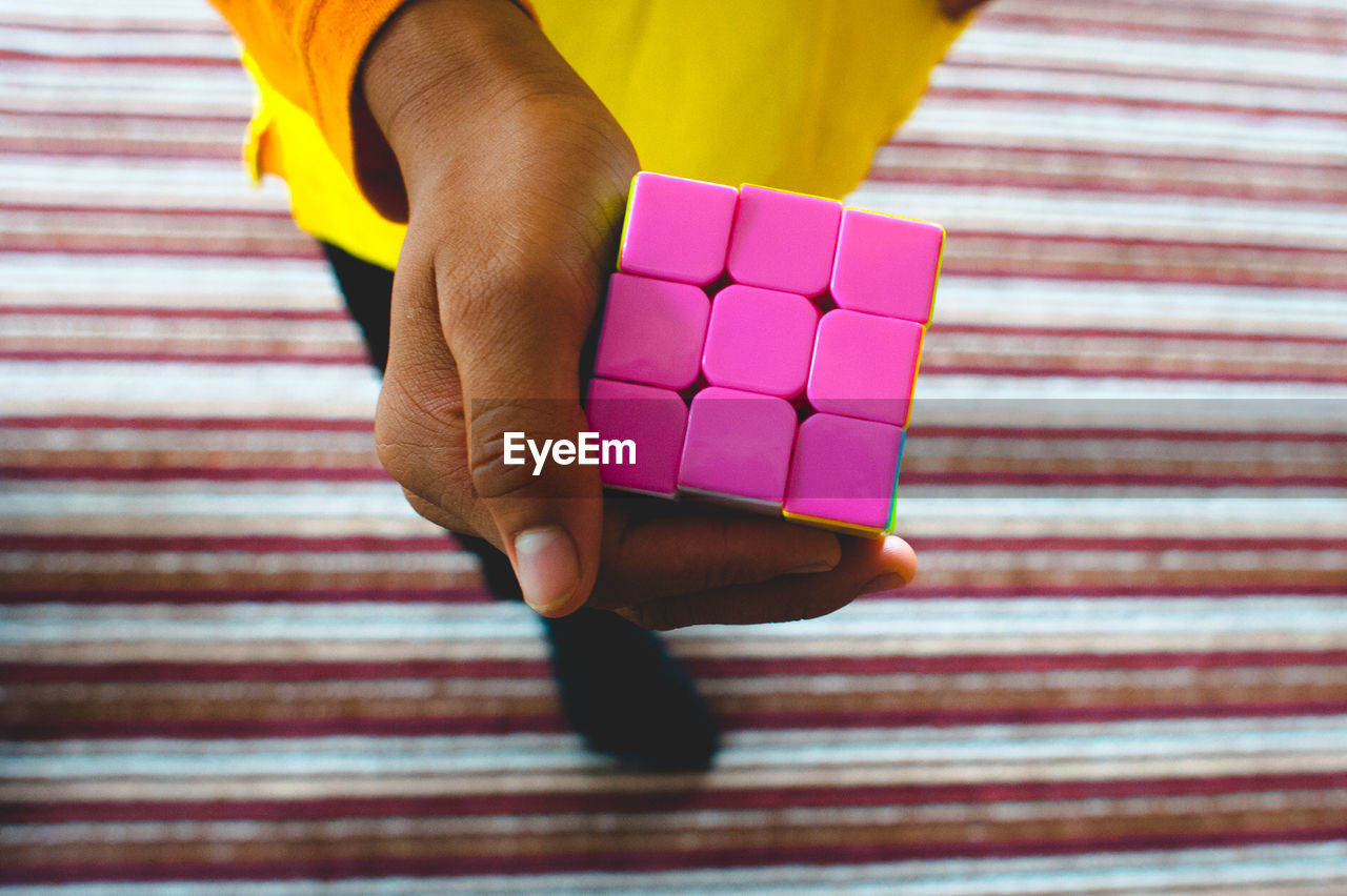 Woman holding cube