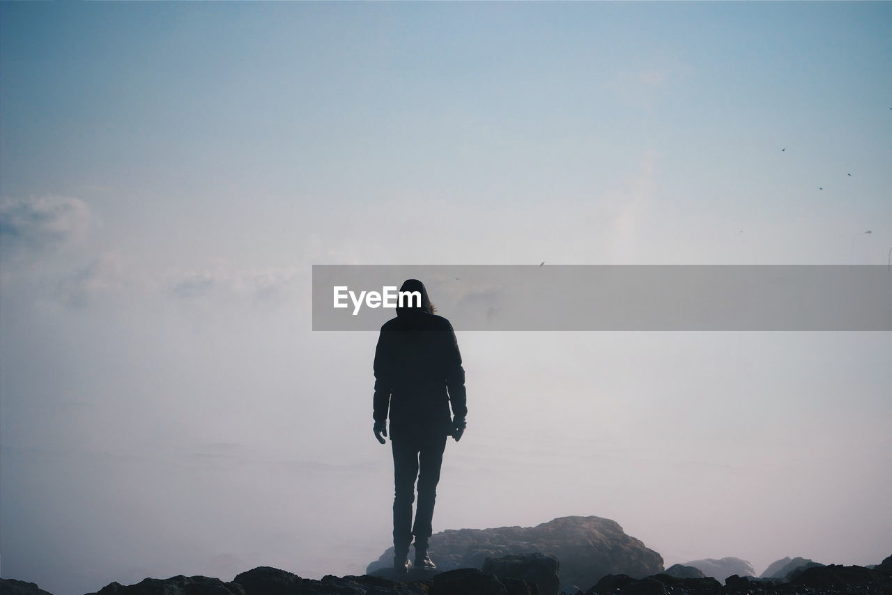 Man standing on rock