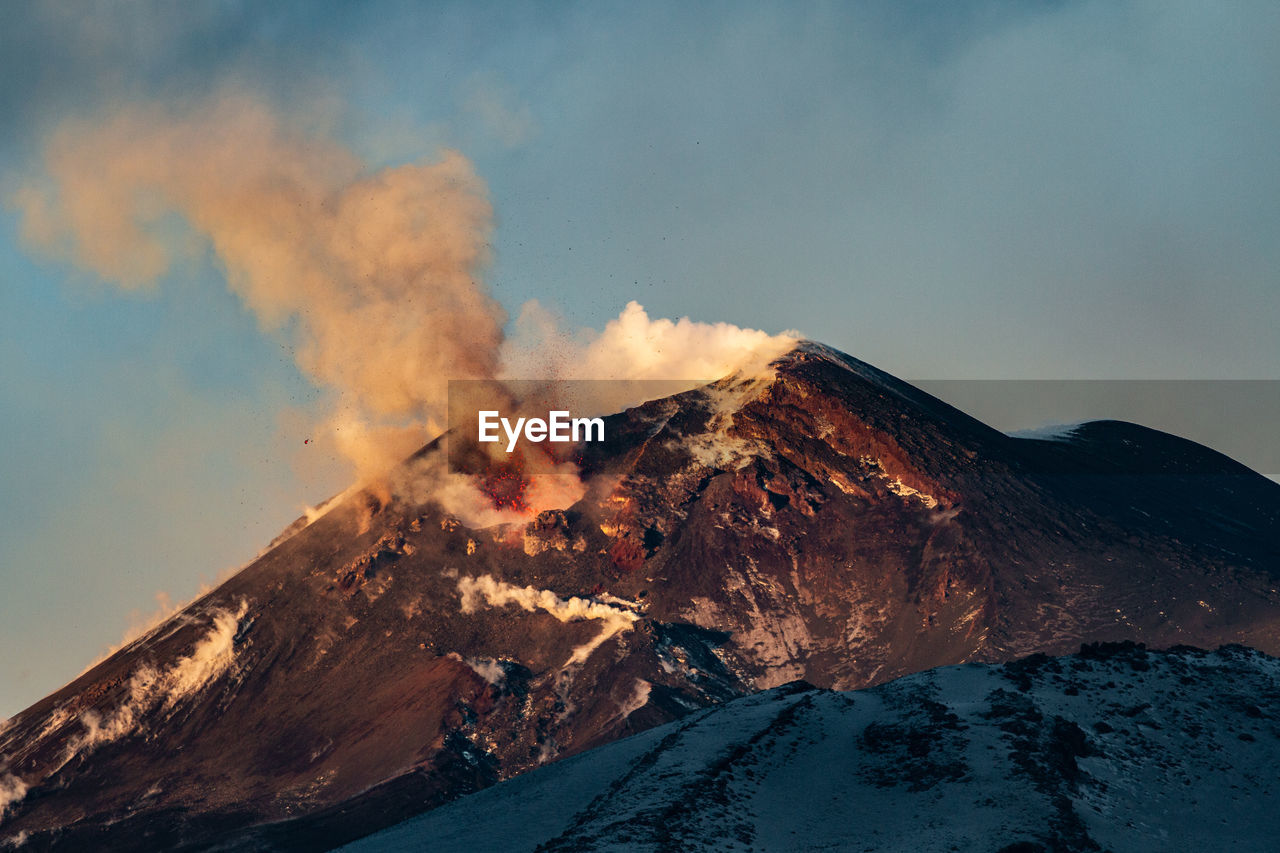 SMOKE EMITTING FROM VOLCANIC MOUNTAIN DURING WINTER