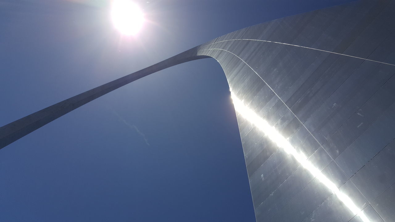 LOW ANGLE VIEW OF SUN SHINING THROUGH SKY