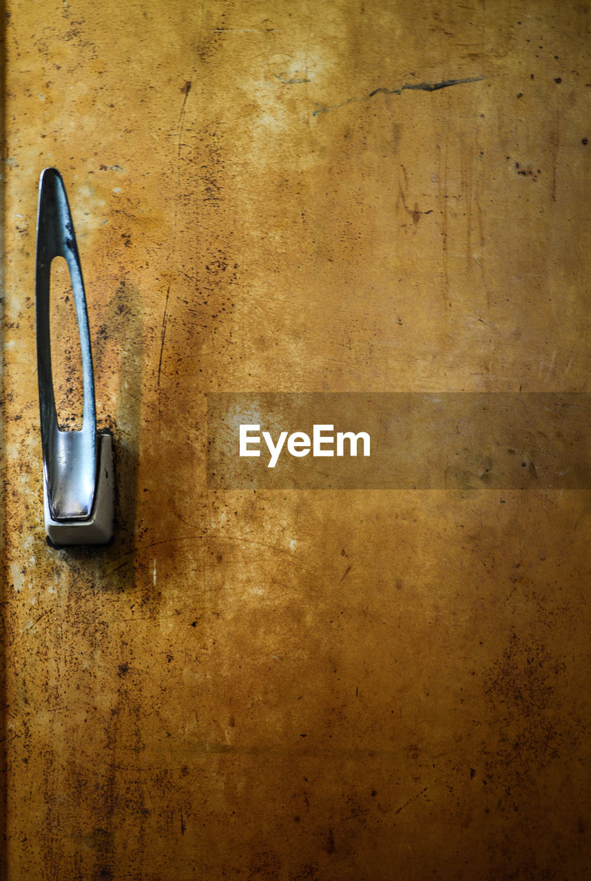 Close-up of handle on old refrigerator