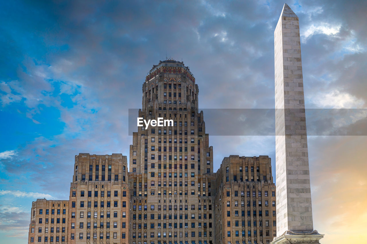 LOW ANGLE VIEW OF MODERN BUILDINGS AGAINST SKY