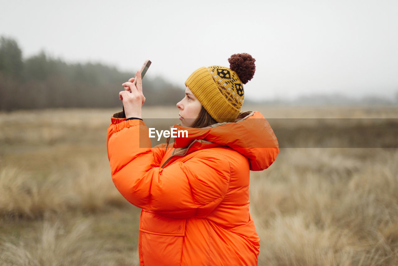 Young woman using smart phone outdoor