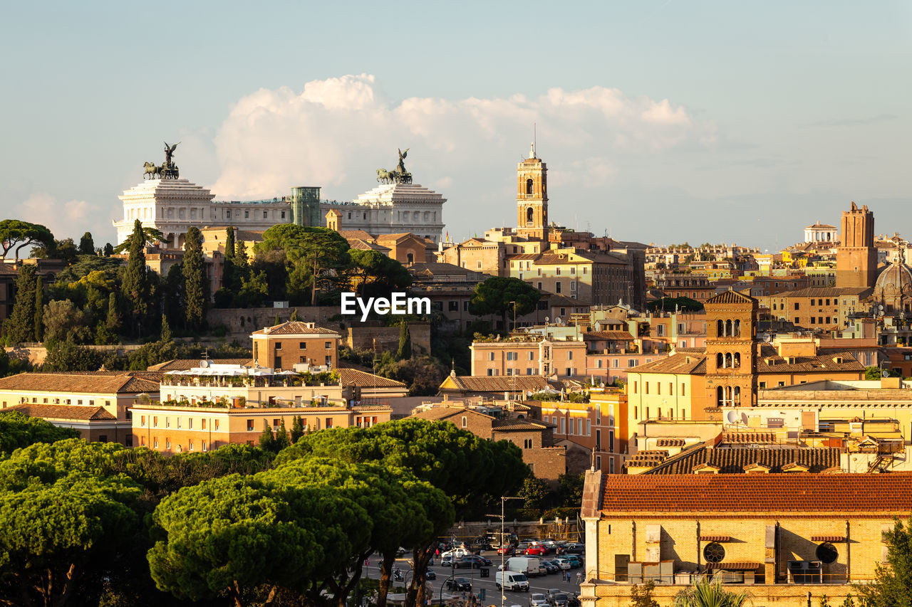 Buildings in city against sky