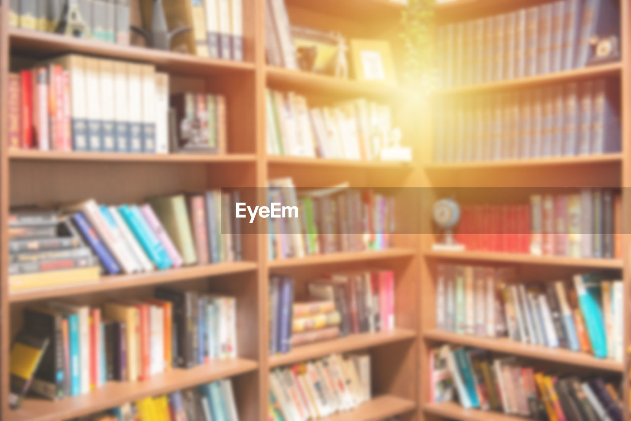 FULL FRAME SHOT OF BOOKS IN SHELF AT LIBRARY