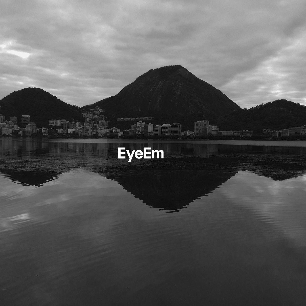 SCENIC VIEW OF LAKE WITH MOUNTAINS IN BACKGROUND