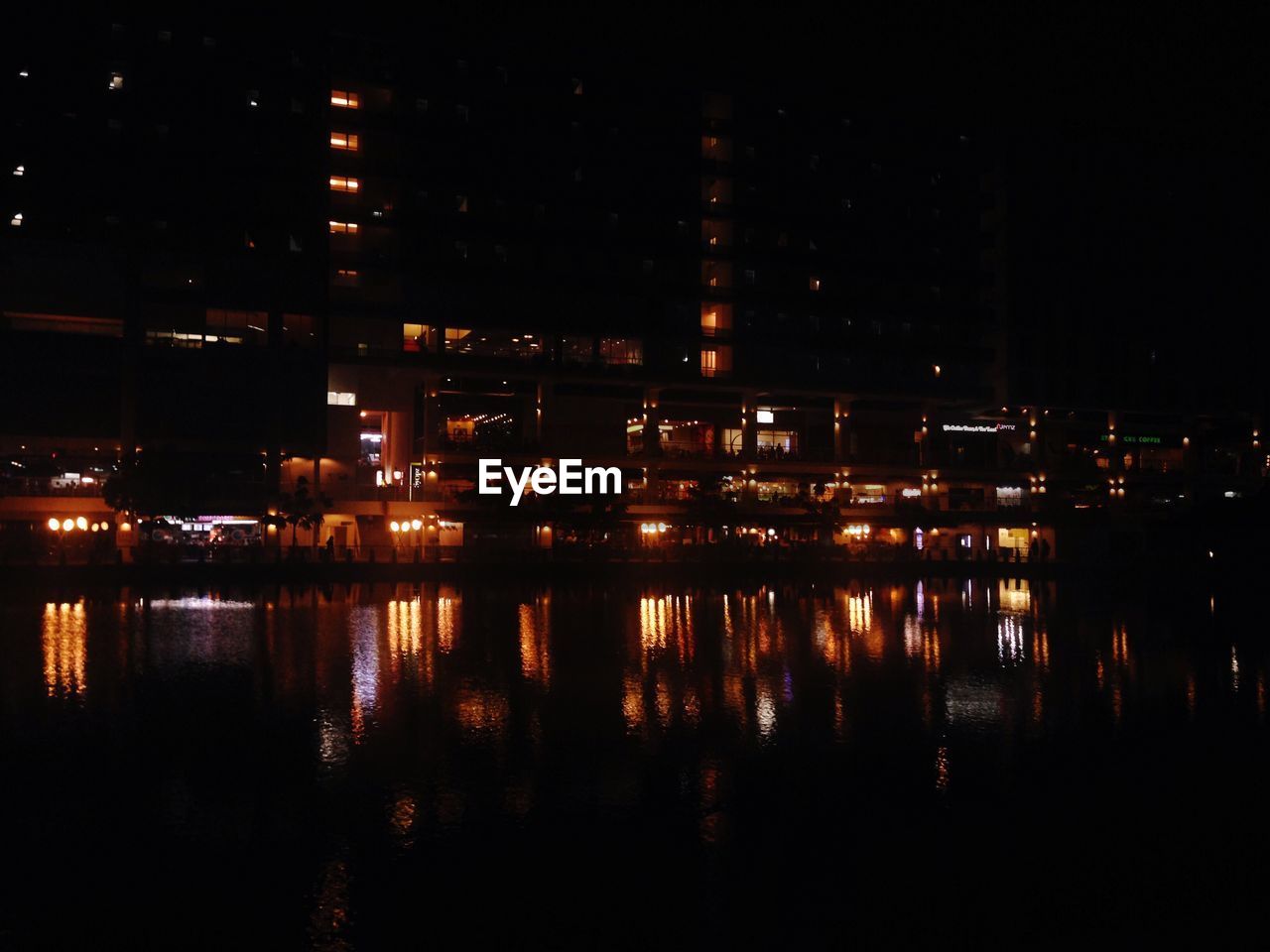 REFLECTION OF ILLUMINATED BUILDINGS IN WATER